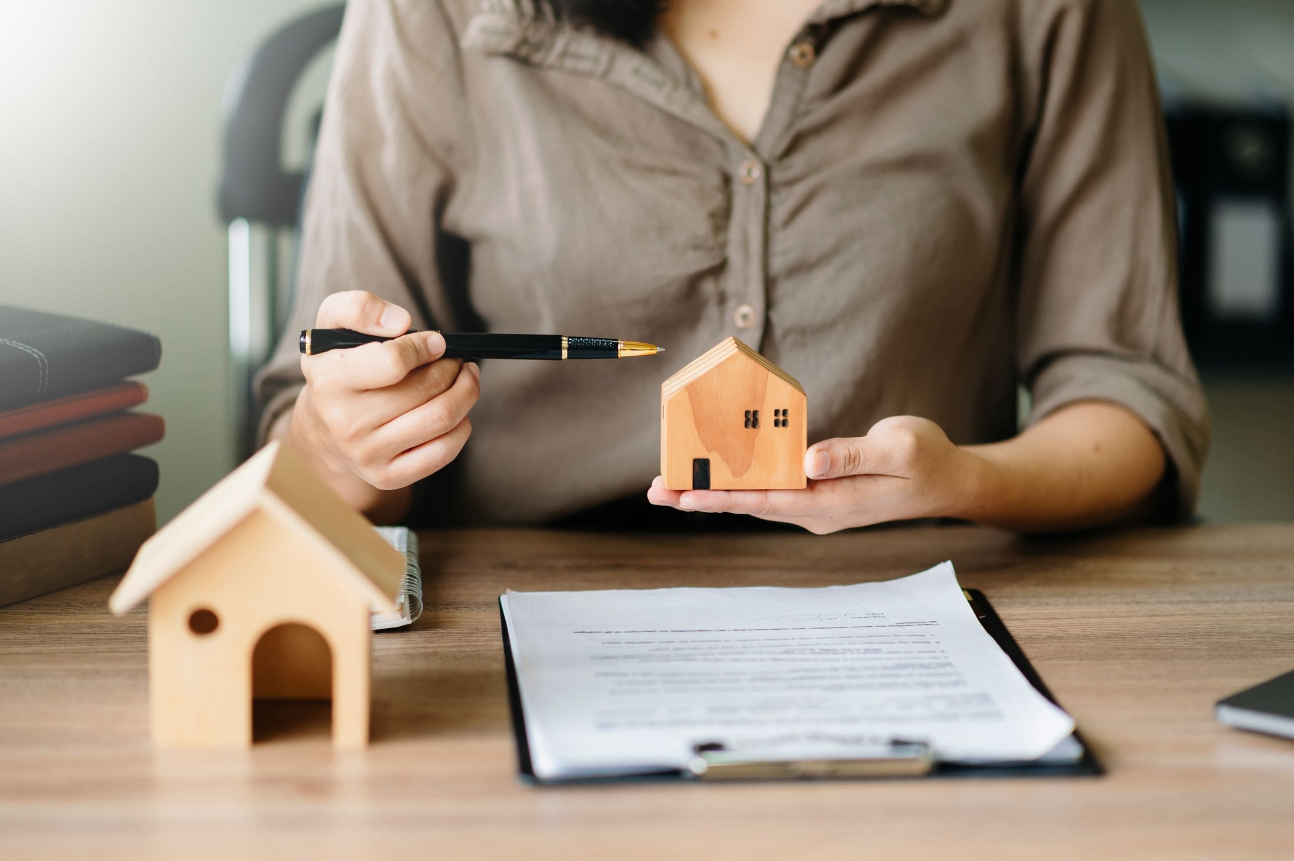 Considering buying a home, investing in real estate. Broker sign